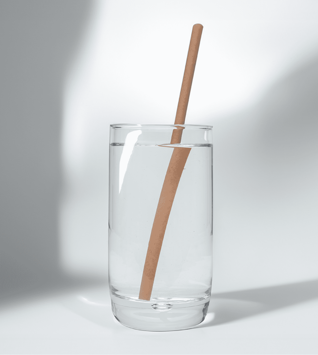 8-inch long, 6mm wide compostable hemp straws in a glass of water